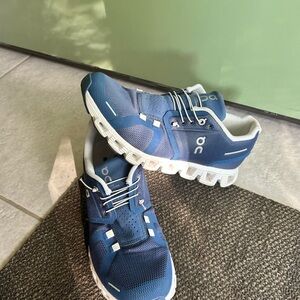 On Running Blue and White Sneakers with Wave Cushioning